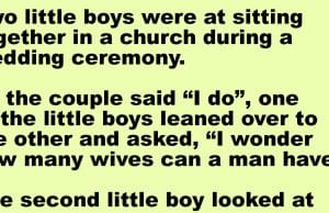 Two little boys were at sitting together in a church