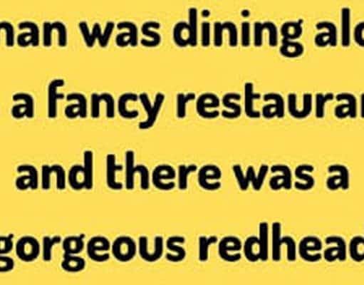 A man and a gorgeous redhead in a fancy restaurant.